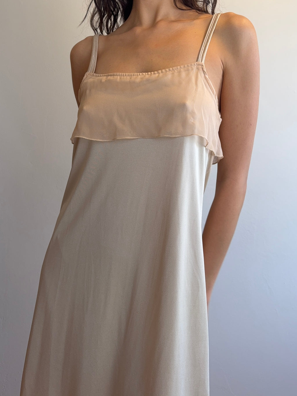 Beige nightgown with lace trim on a plain background